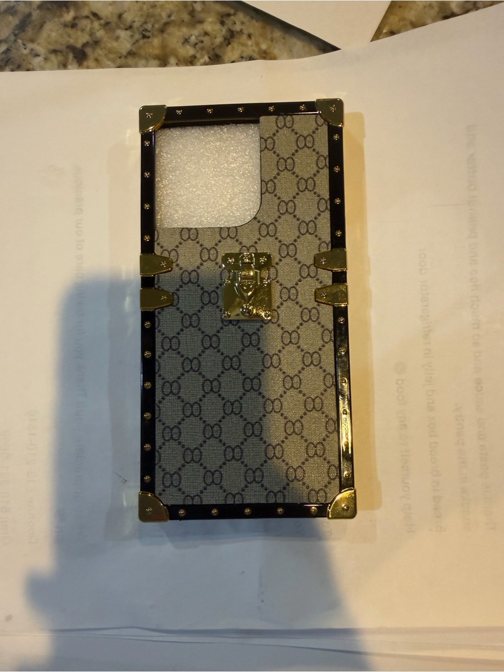 Monogram Trunk-Style Beige and Black Phone Case with Gold Hardware
